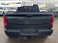 Experience the power and finesse of the 2026 Ram 3500 Laramie 4x4 Mega Cab, cloaked in a bold blue t... (image 3)