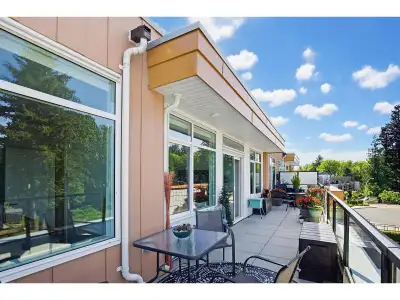 are Top-Floor 3 Bed + Den + 44' Private patio + 2 parking + A/C !! Welcome to Wren & Raven in beauti...
