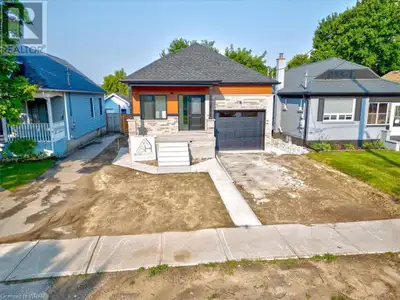 Modern and Versatile! Located in East London, this infill lot features a brand new raised bungalow d...