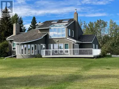 PRICE REDUCED!! This Magnificent Executive home near High Prairie is situated on 11.71 acres. You ha...