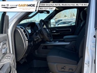 Introducing the 2026 Ram 2500 Big Horn 4x4 Crew Cab with a 64 Box in a vibrant white exterior paired... (image 9)