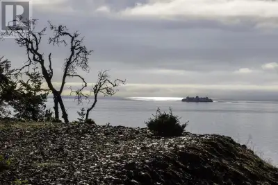 Discover the perfect blend of seclusion and convenience with this rare waterfront island property, j...