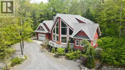Nestled on 5 private wooded acres just minutes from Edmundston, this distinctive A-frame home offers...
