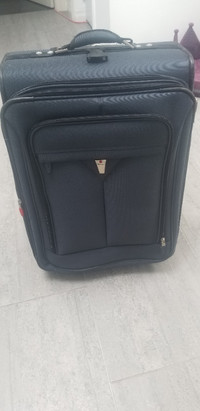 Delsey Medium Size Blue Rolling Luggage Suitcase
