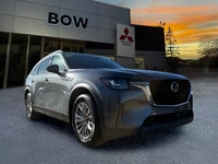 The 2025 Mazda CX-90 MHEV GS-L in a sophisticated gray finish beckons those seeking a premium drivin... (image 2)