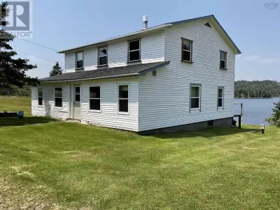 Oceanfront home with 2111 sqft. of renovated living space on two levels with a large deck overlookin...