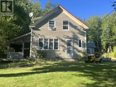 Searching for a quiet, camp-like retreat? This year-round home on 4.52 acres offers the perfect bala...