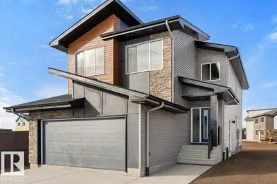 Built by Sterling Homes, this front-attached home in The Uplands at Riverview blends luxury finishes...