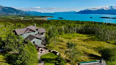 Welcome to 1 Moose Hill Road, Atlin, BC—your ultimate wilderness retreat! This architecturally-desig...