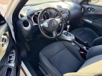This 2012 Nissan Juke (JAPANESE)is a reliable SUV with a stylish white exterior and a sleek black in... (image 4)