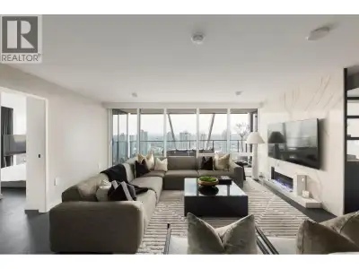 Elevated & updated corner home at 8X on the Park with panoramic views of False Creek, city, and moun...