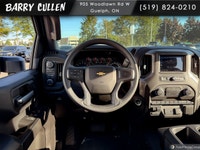 The 2026 Chevrolet Silverado 2500HD Custom is a striking white truck with a powerful 44 drivetrain t... (image 9)