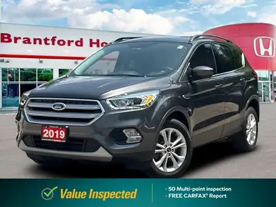 Confident command meets exceptional convenience in this superb gray 2019 Ford Escape SEL sport utili...