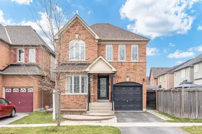 Welcome to 14 Marriner Cres This premium end lot detached home offers over 2,300 sqft of luxurious l...