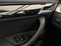 The 2018 X1 xDrive28i serves as a versatile "Sports Activity Vehicle" SAV tailored for urban environ... (image 8)