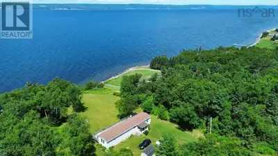Welcome to your Waterfront Retreat on the Bras dOr Lakes. This charming home, nestled on over 3 acre...