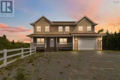Welcome to waterfront living in an exclusive Porters Lake subdivision. Set on a private 1.31-acre lo...