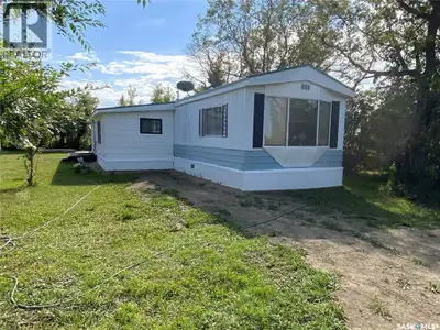 Looking for quiet low cost living but close to bigger community. This 3 bedroom Mobile with large ed...