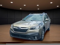 Experience the perfect blend of adventure and style with this 2022 Green Subaru Outback Touring AWD,... (image 1)