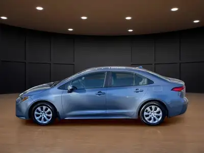 The 2023 Toyota Corolla LE in gray is a forward-thinking sedan that seamlessly marries stylish desig...
