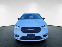 The 2024 Chrysler Pacifica Touring-L FWD, dressed in a pristine white finish, offers a smooth and co... (image 1)