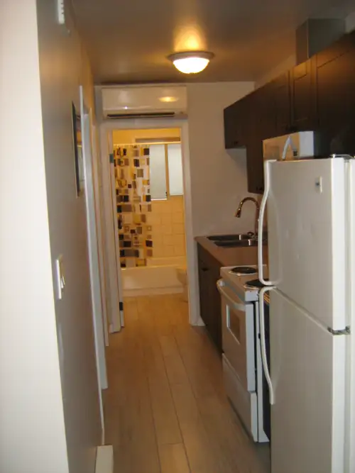6754 Cranberry Street Mountain View Apartments Unit 7: Level entry from sidewalk with covered deck o...