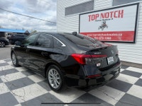 A modern and efficient compact sedan with a refined interior, advanced safety features, and smooth t... (image 5)