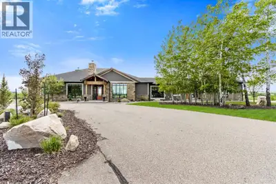 Stunning Custom Built Bungalow sitting atop the biggest hill on 122 acres with breathtaking views in...