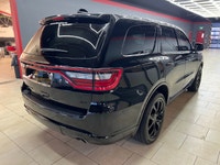 Experience the bold presence and versatility of the 2019 Dodge Durango GT in striking black with an... (image 7)