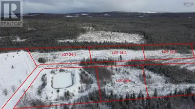 Nestled atop a picturesque hill off Route 19, coming into the beach capital of Cape Breton, PortHood...