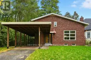 Welcome to this custom one of a kind home with vaulted living room with gas fireplace, awaiting a ve...