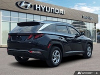 The refined 2022 Hyundai Tucson Preferred, stunning in Deep Sea Blue, combines everyday practicality... (image 4)