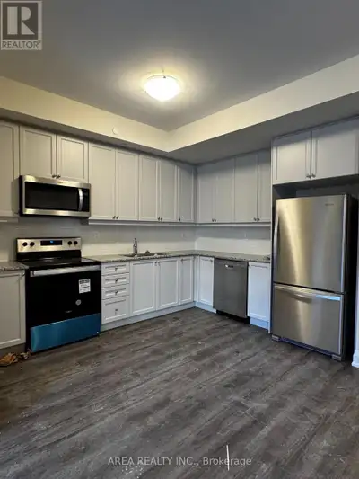 Beautifully finished 2 Bed, 2 Bath stacked townhouse corner unit with parking and storage locker! Ov...