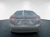 The 2023 Toyota Corolla Hybrid LE in stunning gray, boasts a fuel-efficient FWD drivetrain known for... (image 5)