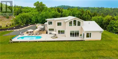 Tucked away in an exclusive community on the shores of Lake Utopia. This extraordinary estate panora...
