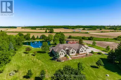 Welcome to your dream retreat! This custom stone bungalow (2003) sits on a sprawling 24-acre propert...
