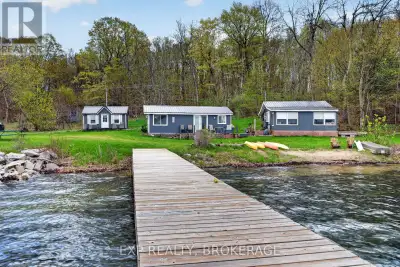 Experience waterfront living on beautiful Wolfe Island with this unique cottage property set onappro...