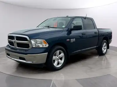 Experience the robust and versatile 2023 Ram 1500 Classic SLT, adorned in a striking blue finish. Th...