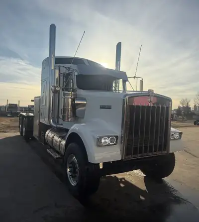 Extensive body work and brand new paint adorn this fully restored and like brand new wrecker! The W9...