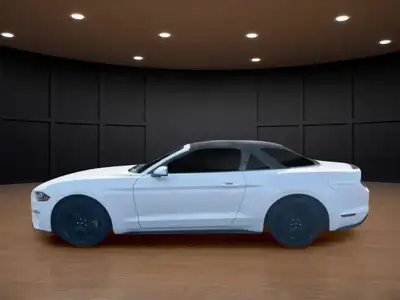 The 2020 Ford Mustang EcoBoost Convertible is a true standout in a pristine white finish, offering t...