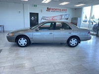 The 1998 Toyota Camry is a fuel-efficient midsize sedan known for its long-lasting durability, smoot... (image 1)