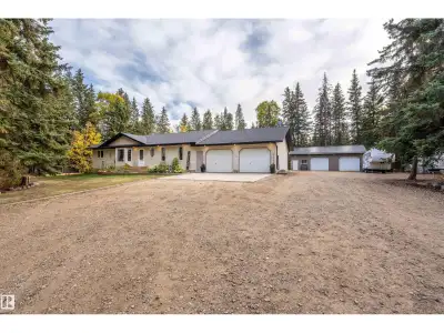 Immerse yourself in privacy and tranquility on this scenic acreage that is majestically framed with...