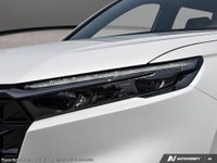 The 2026 Honda CR-V Hybrid EX-L AWD, dressed in a sophisticated white exterior and outfitted with a... (image 9)