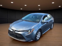 The 2021 Toyota Corolla LE in sleek gray with its reliable front-wheel drive and automatic transmiss... (image 1)