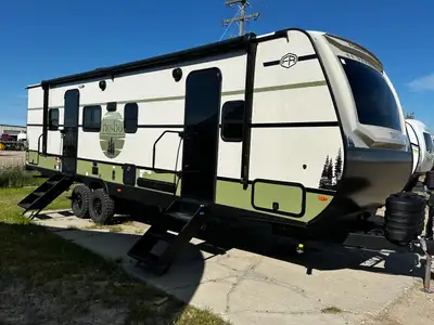 Spacious and family-friendly, this travel trailer features a front queen bedroom with dual wardrobes...