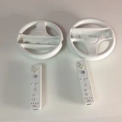 Nintendo Wii Wheels and Wii Remotes. One remote is no working I guess . All for 20 dollars. The Wii...