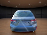 The 2023 Toyota Corolla LE in gray is a forward-thinking sedan that seamlessly marries stylish desig... (image 6)