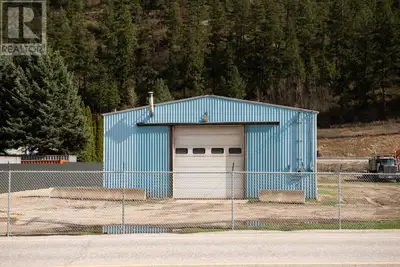 Take advantage of this updated 1/2 acre fenced commercial property offering unbeatable highway expos...