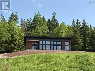 Discover this stunning modern chalet nestled in the serene hills of Glenville, just steps from the r...