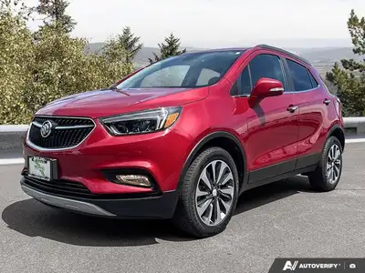 The 2020 Buick Encore Essence, dazzling in Winterberry Red Metallic with a sophisticated Ebony leath...
